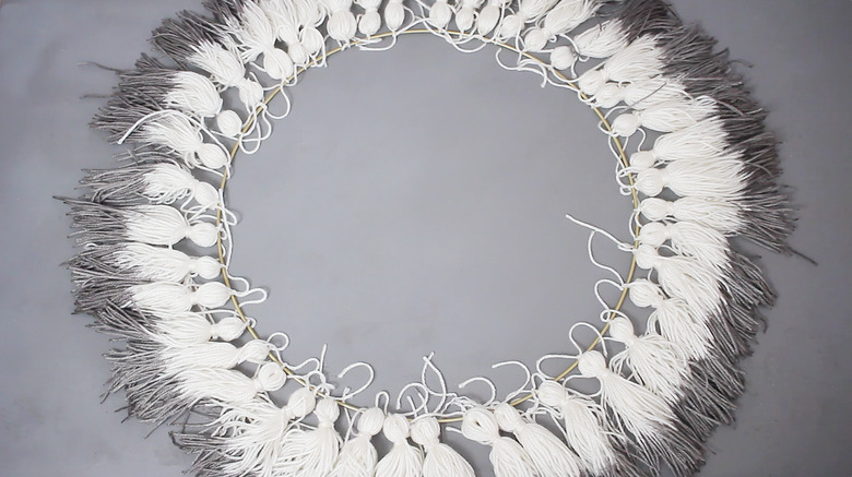 Tassels tied around circumference of large hoop