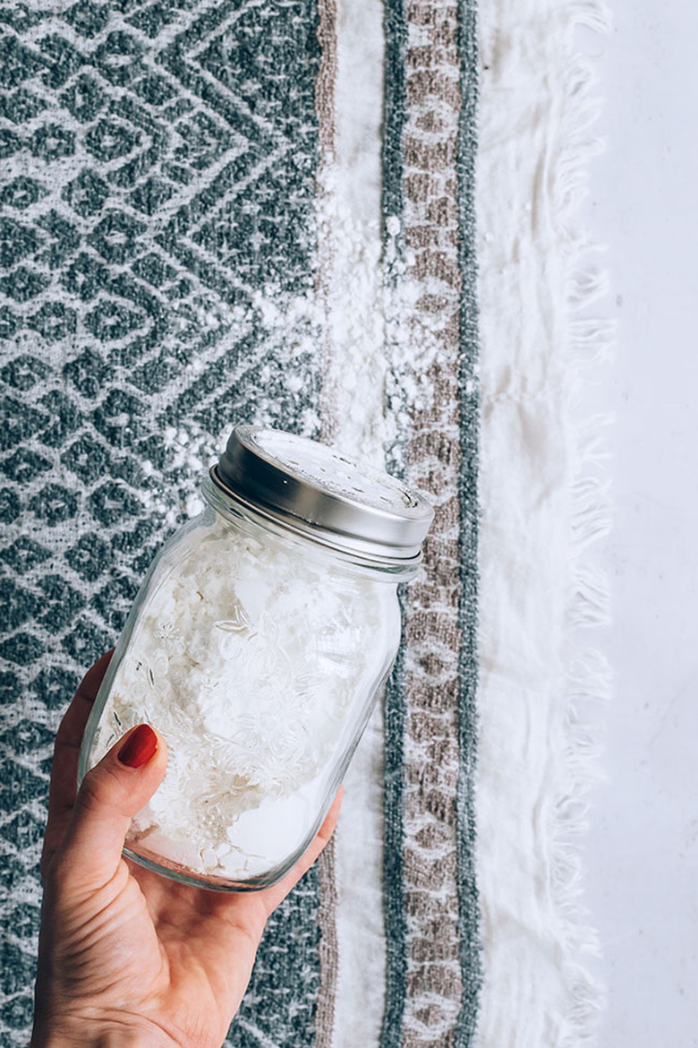 Apply baking soda mixture to carpet