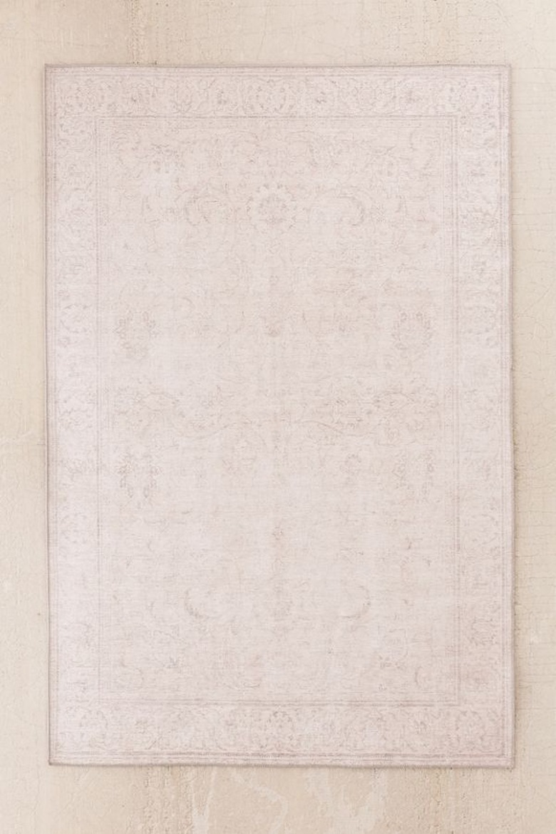 Beige area rug with subtle border