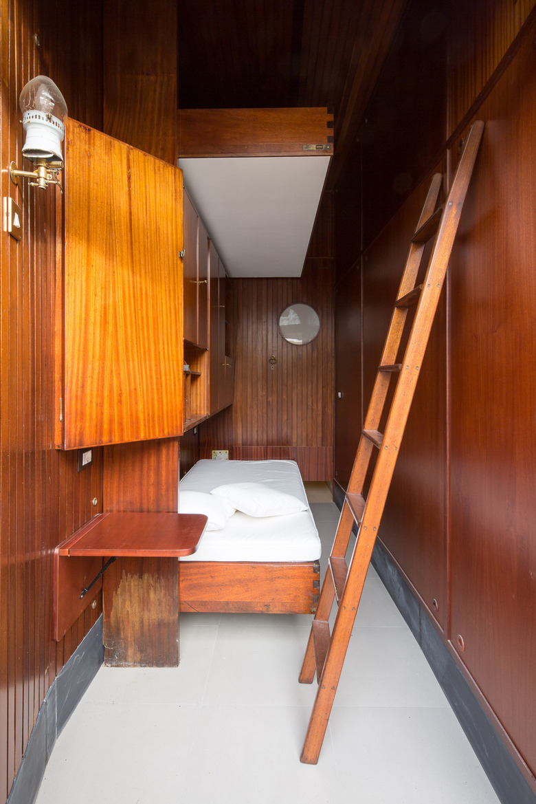bedroom with wood walls