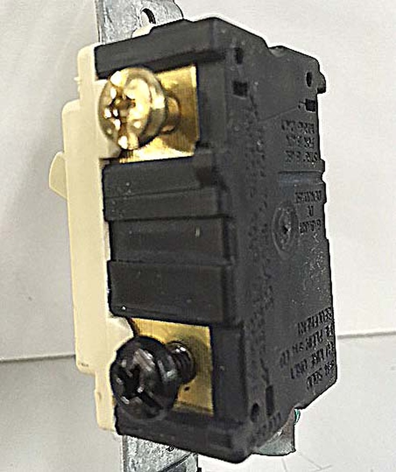 Close-up of a three-way switch.