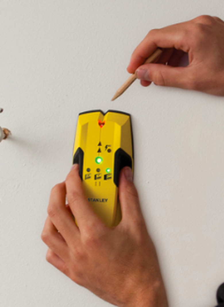 Stud finder in use.