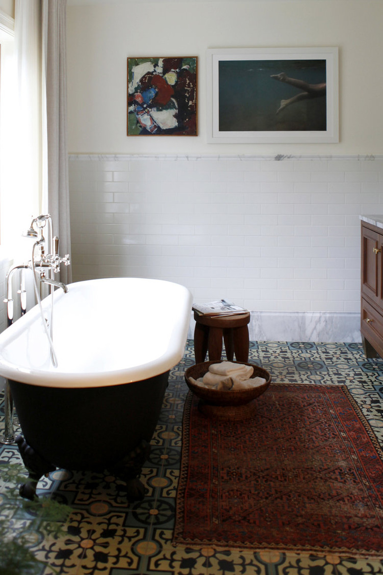 traditional bathroom idea with black clawfoot tube