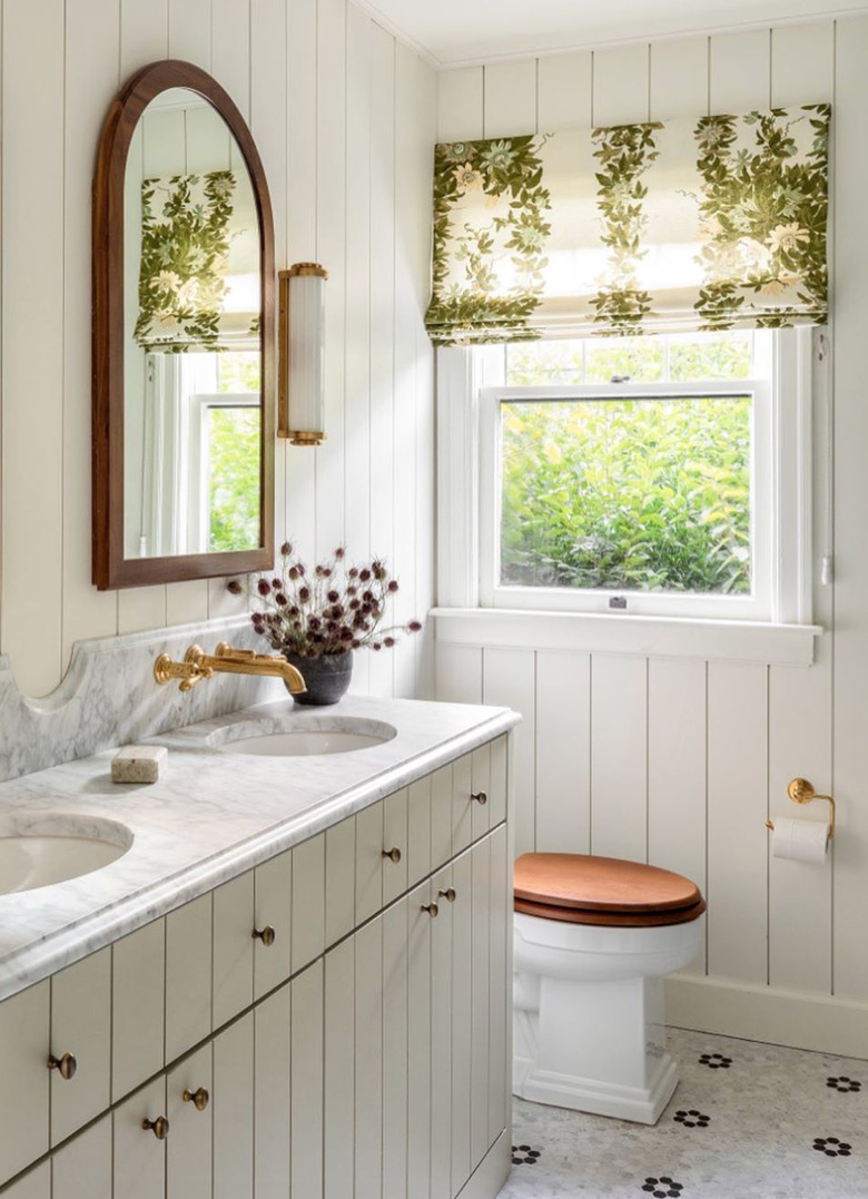traditional bathroom idea with tongue and groove walls and cabinets