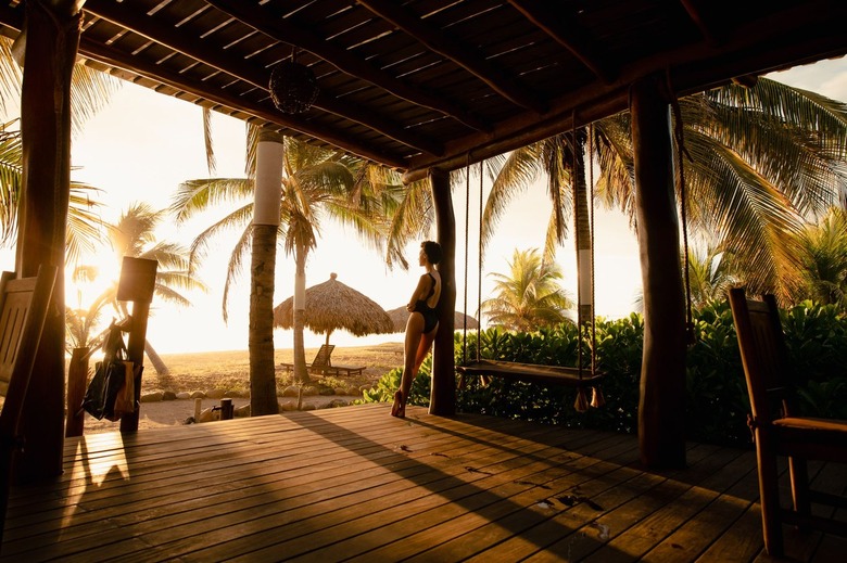 person in outdoor area with low lighting and trees in the distance