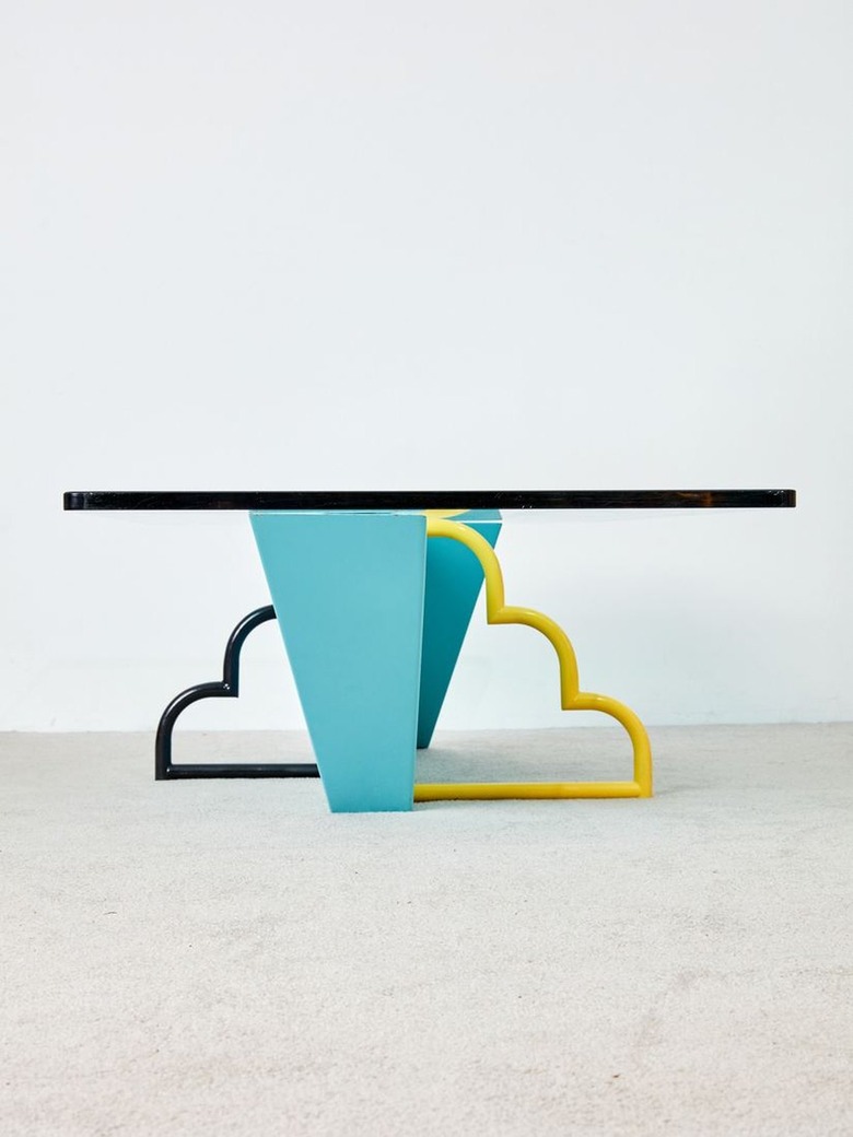 table with cloud legs in black and yellow with blue leg in middle