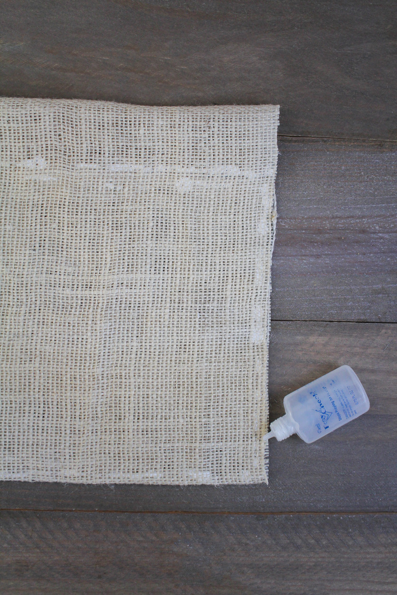 Coating sides of burlap with liquid seam sealant