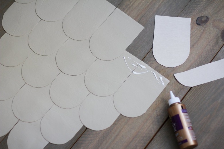 Leather scallops with fabric glue on wood floor