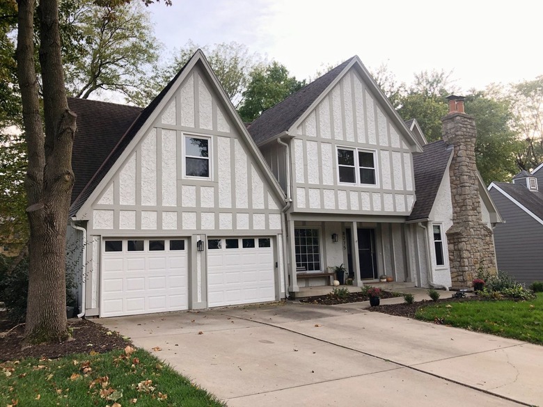 beige and taupe tudor with wood timber detail