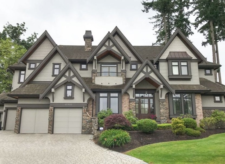 green-gray and brown Tudor home