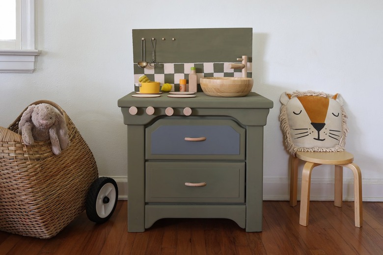 DIY olive green kids play kitchen with checkerboard backsplash and blonde wood accents