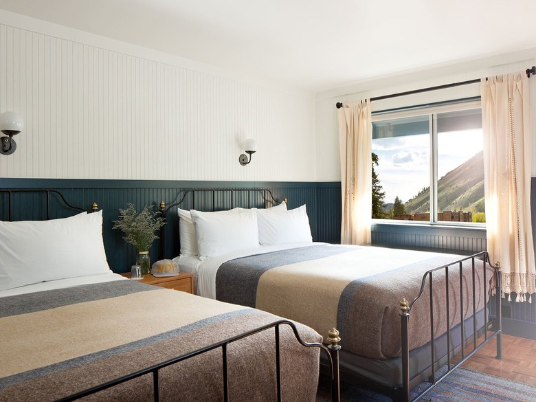 bedroom with green and white bead board walls