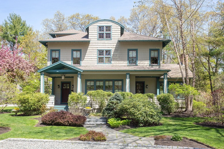 tan house with blue paint