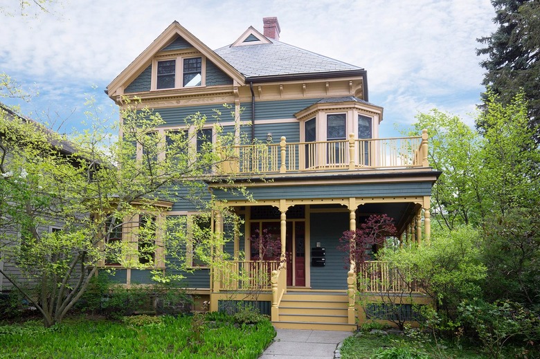 blue house with yellow paint