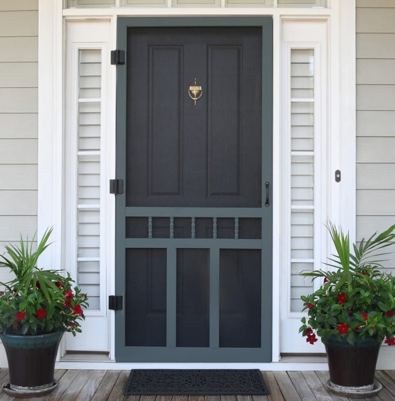 Black front door with screen door