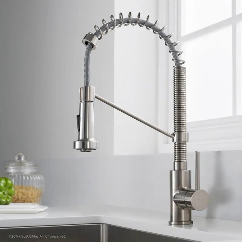 A chrome pull-out kitchen faucet