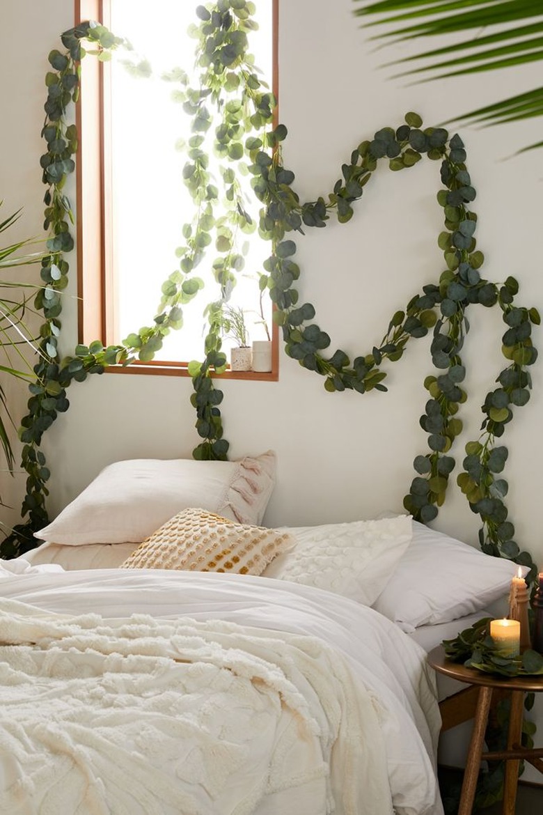 vine garland above white bed