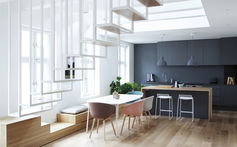 unexpected kitchen storage idea hidden below dining bench seating