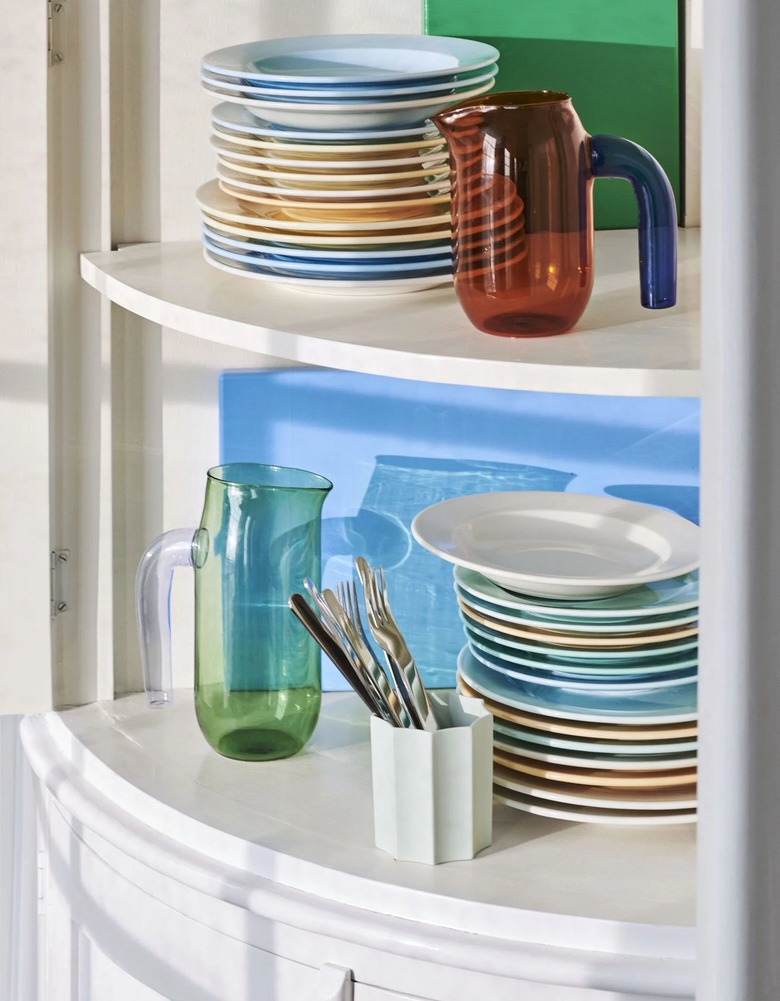 shelves with colorful plates and pitchers