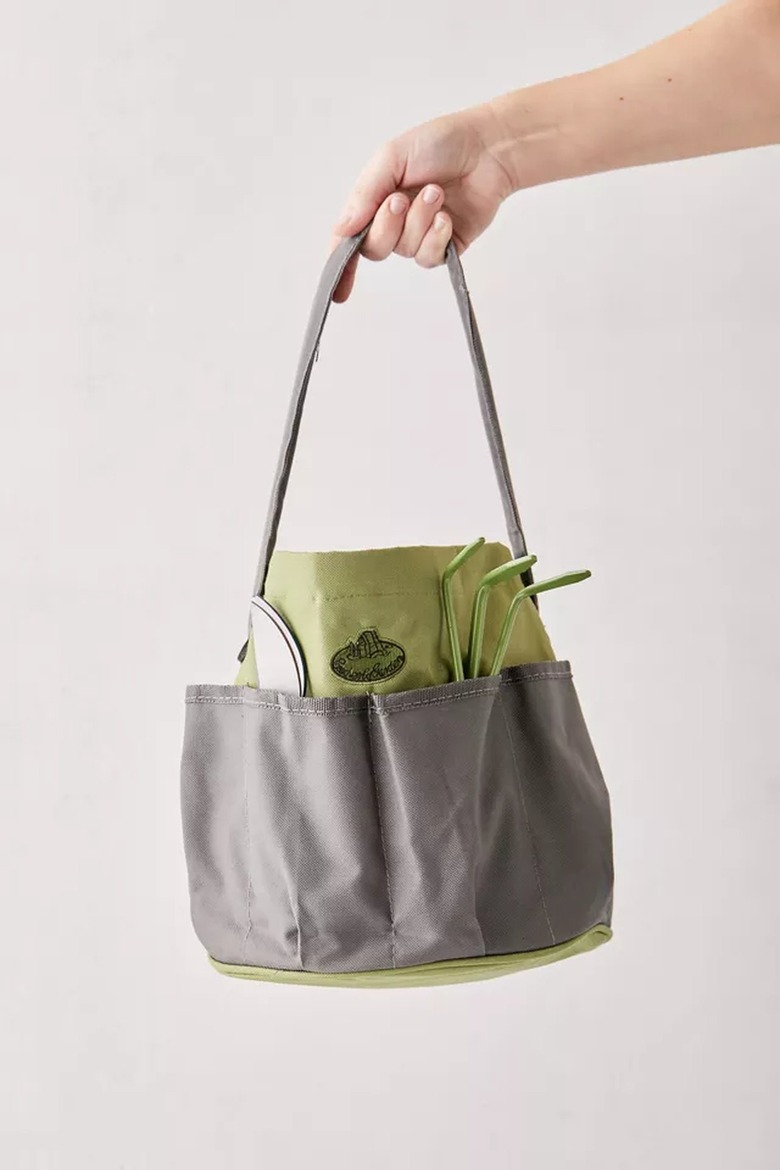 hand holding a garden tool bucket tote bag
