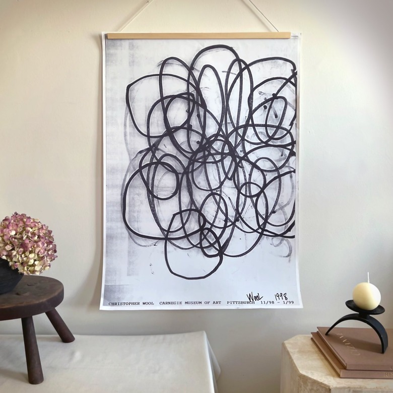 A vintage Christopher Wool-signed Carnegie International print showing black circular line work.