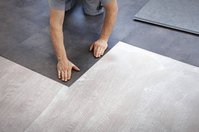 Worker making vinyl flooring