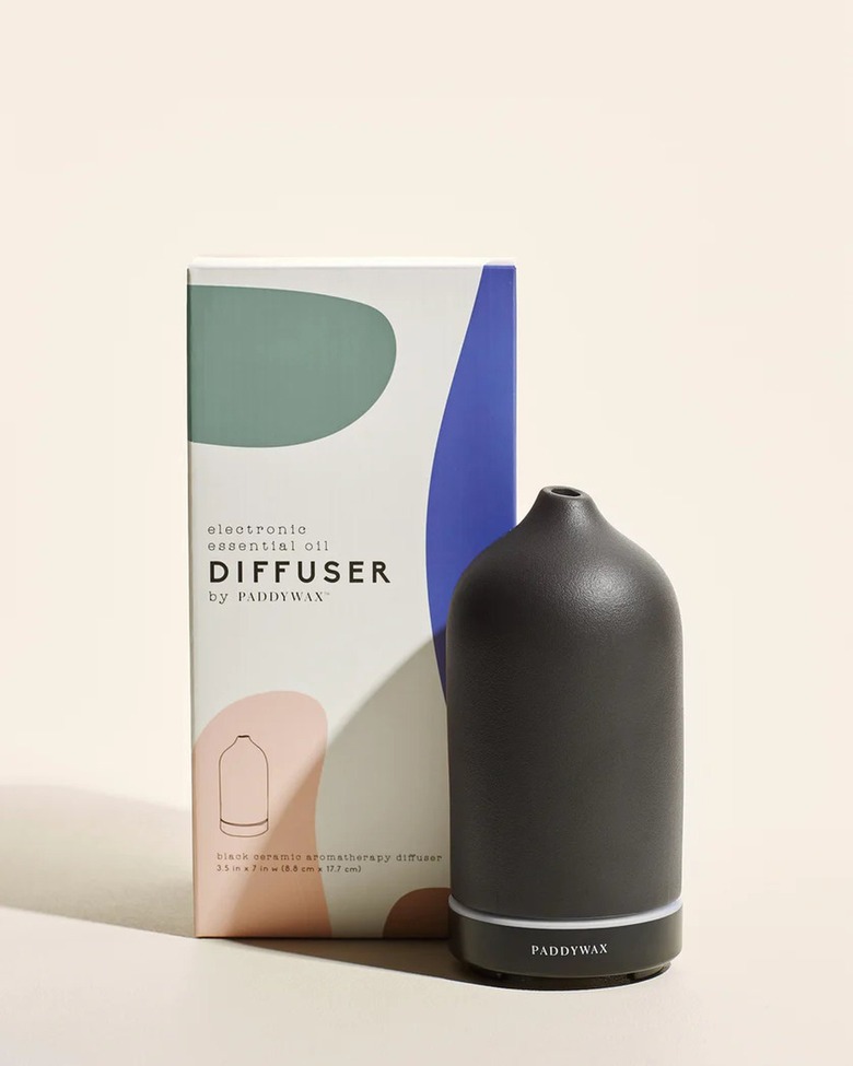 Black diffuser in front of light pink background