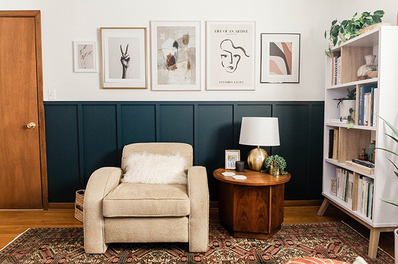 living room with forest green walls and dark brown floors