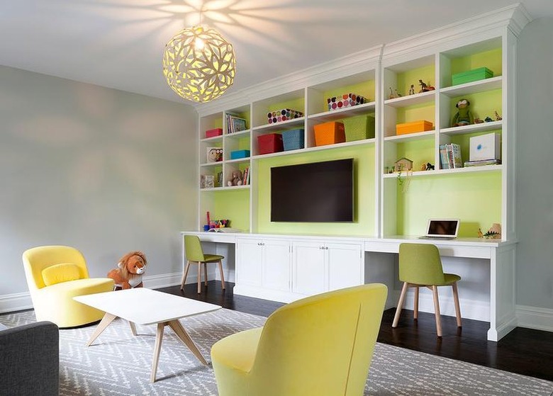 room with dark brown floors and lime green walls