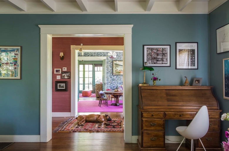 Living room with turquoise walls.