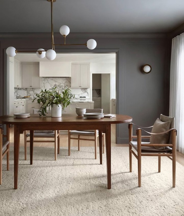 Dining room with dark gray walls.