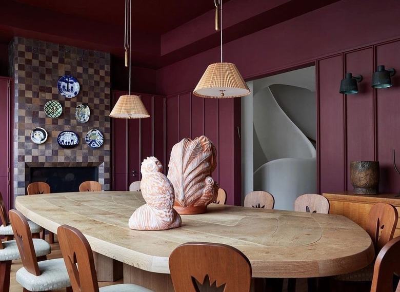 Dining room with eggplant walls.