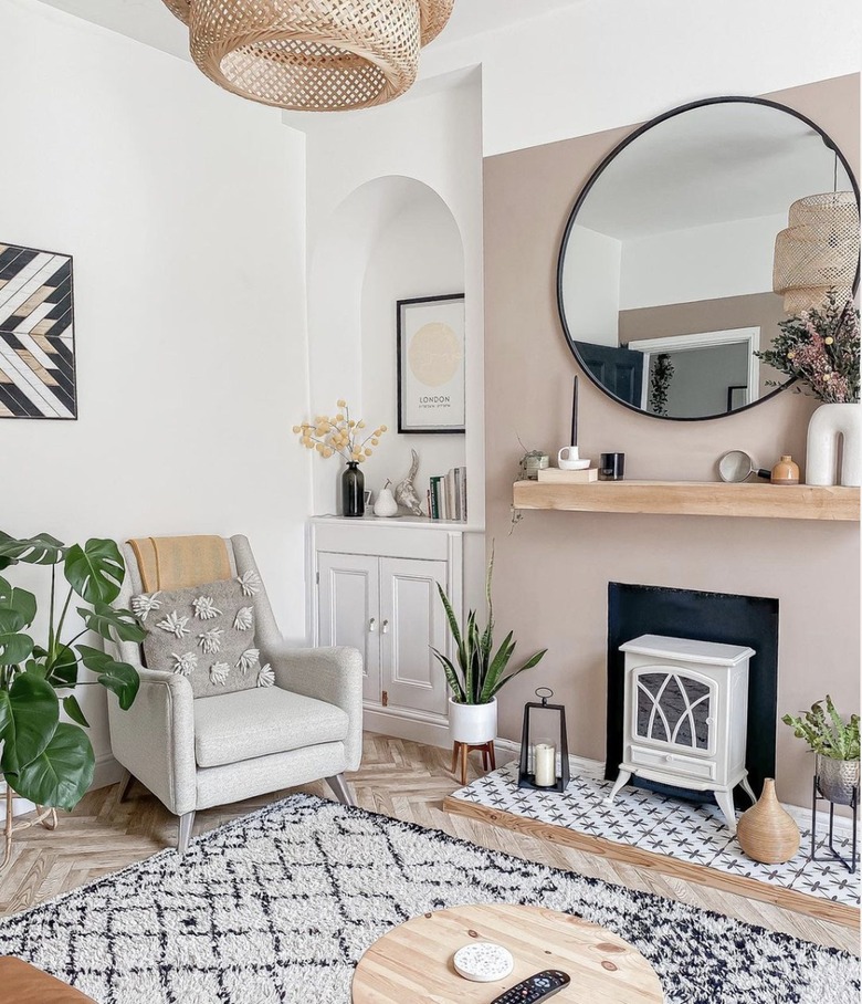 Living room with wood floors and a taupe accent wall.