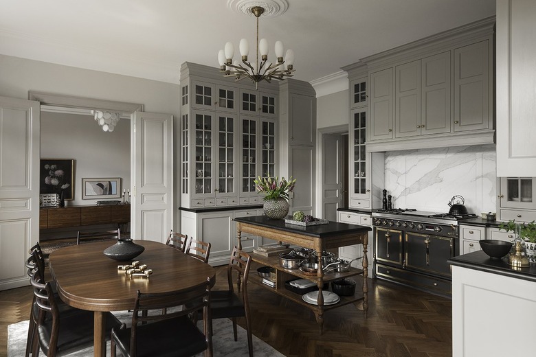 Kitchen with gray cabinets and dark wood floors.