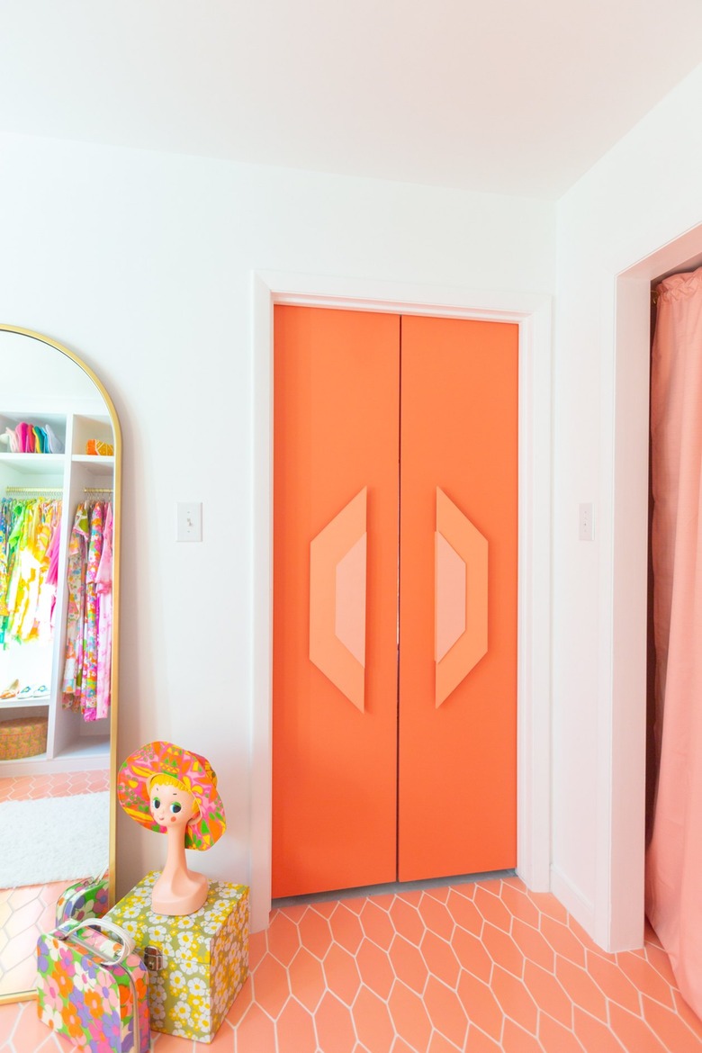 orange French doors in bright closet