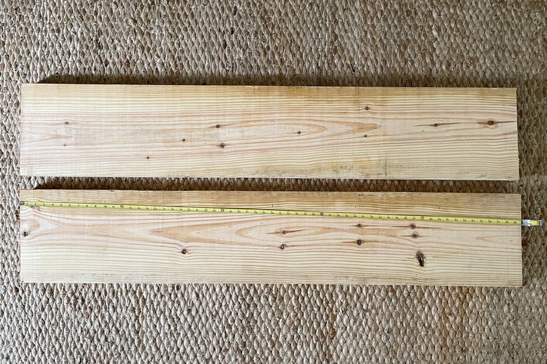 Two long 2x12 wood boards cut to 60 inch lengths