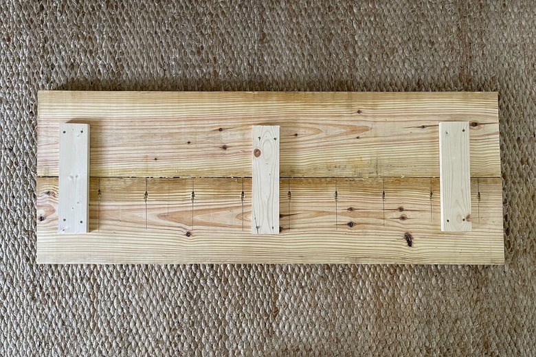 Three 1x4 support pieces attached across the seam of the bench seat