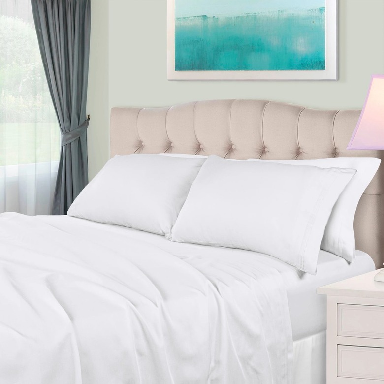 white bedding on bed