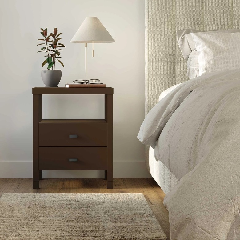 wooden nightstand next to bed