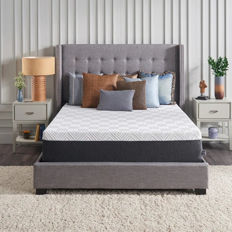 mattress on gray fabric bed