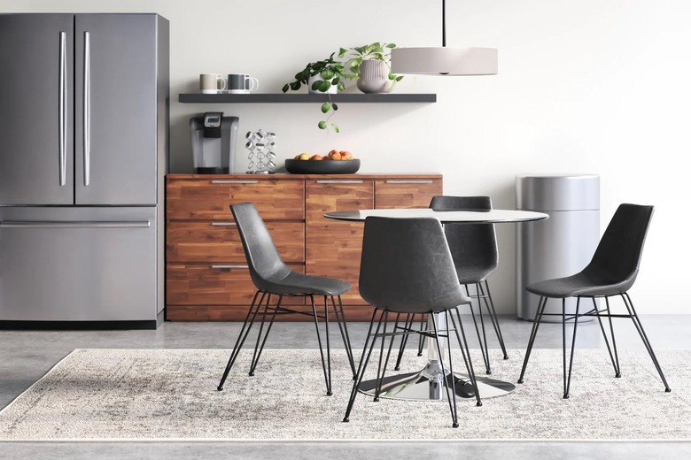 dining room with modern chairs and rug