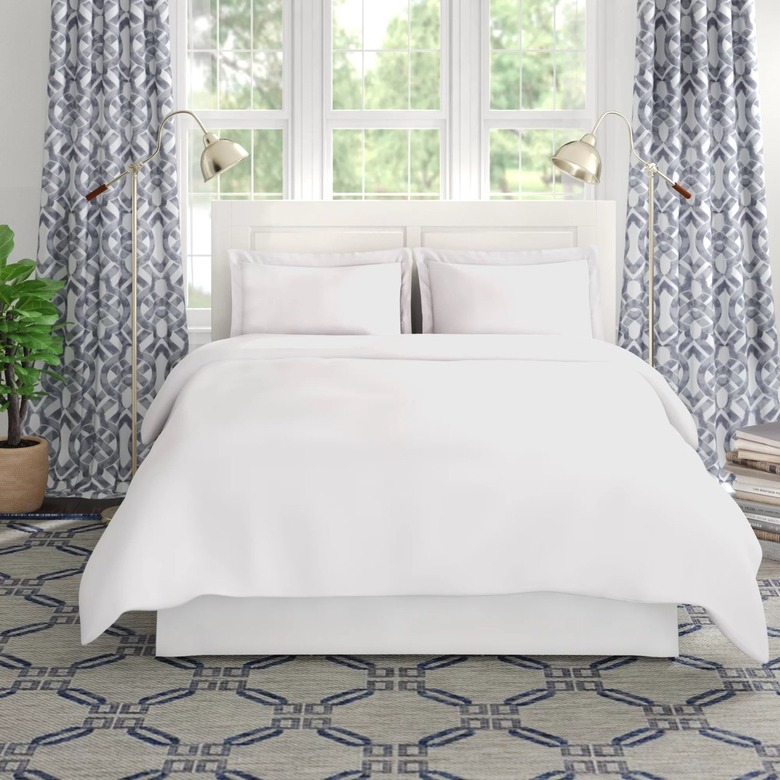 white bedding in coastal room