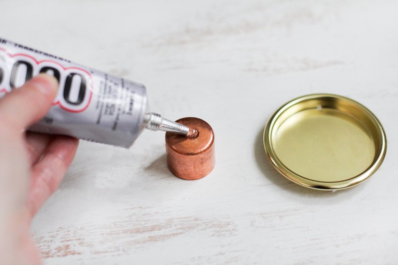 Glue being applied to cup pull