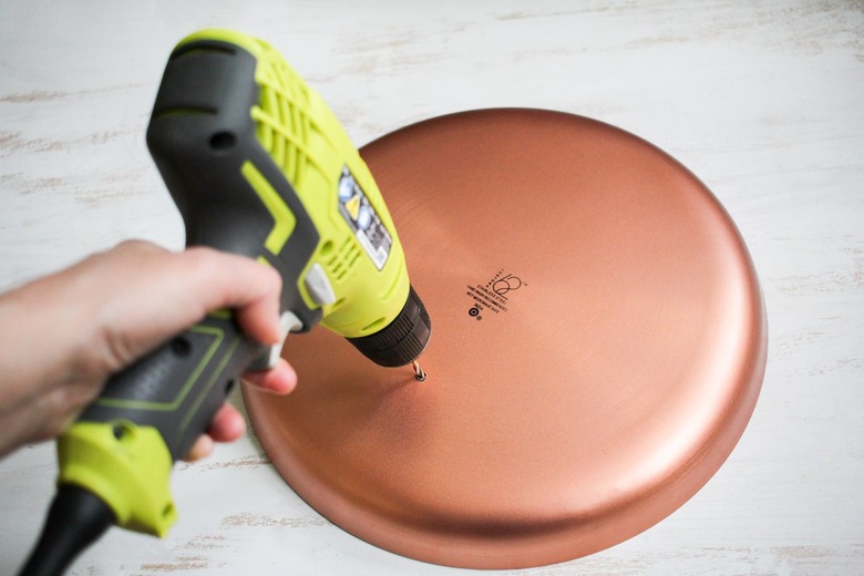 Round metal plate and drill