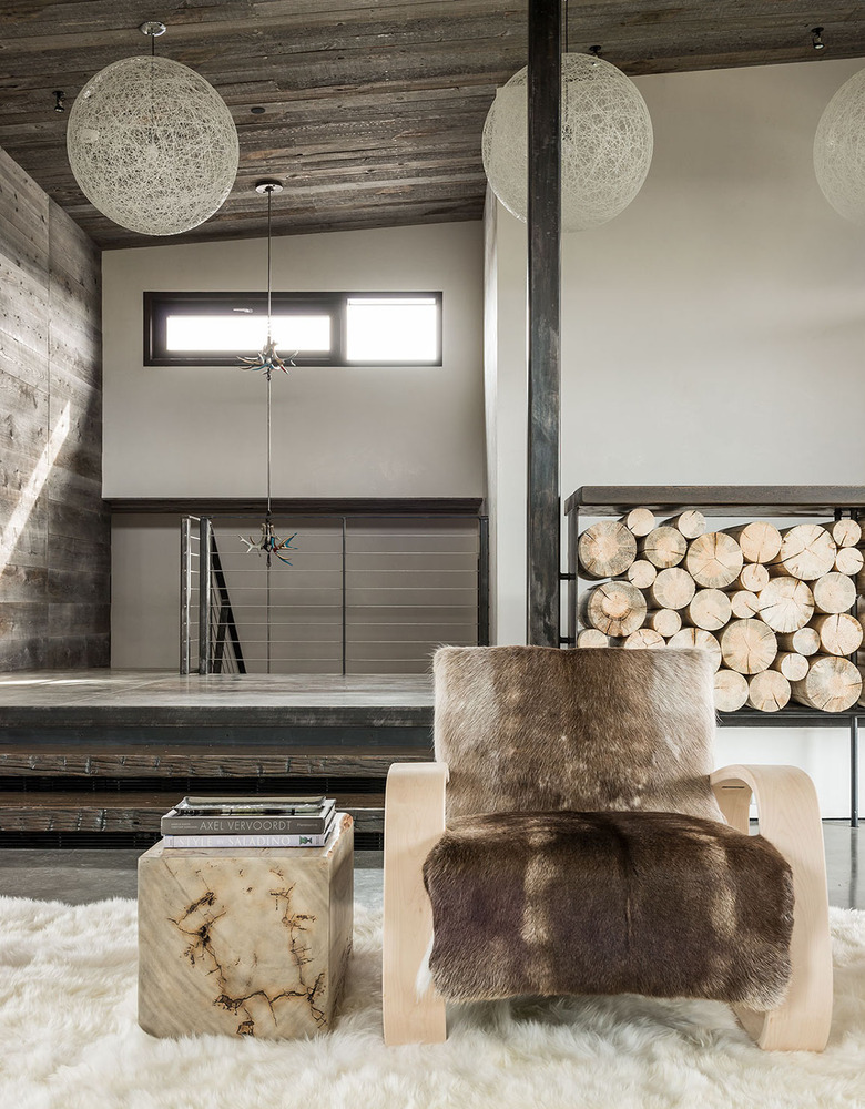 Contemporary rustic living room with hide throws