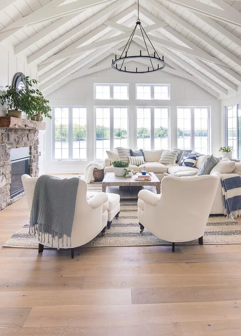 Coastal themed living room with exposed beams