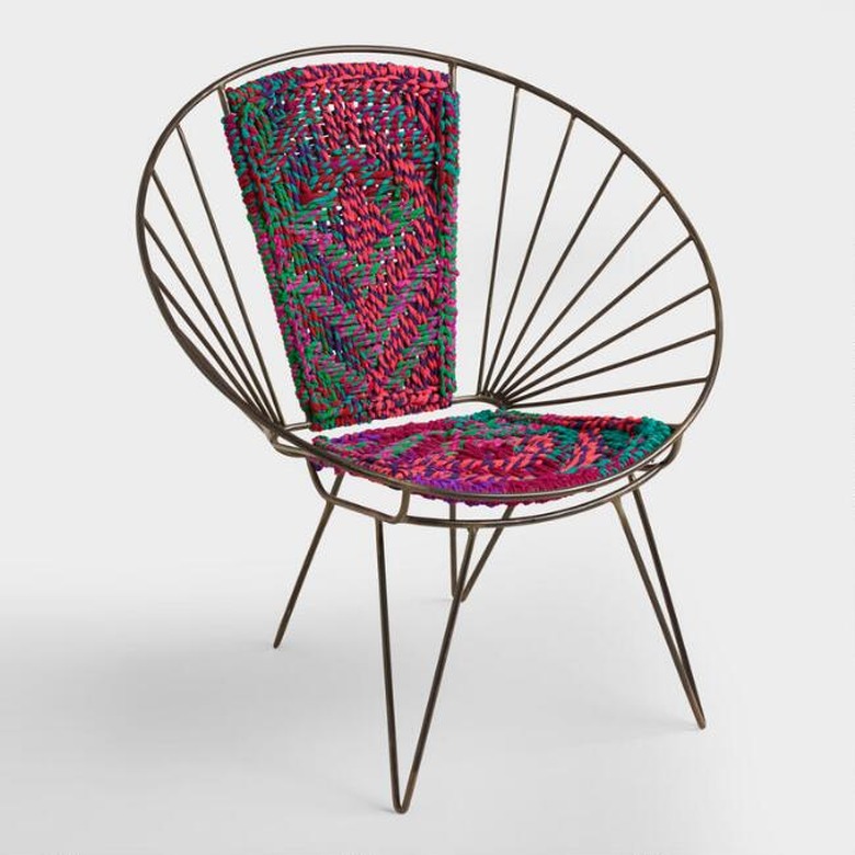 Metal chair with a woven patterned center for bohemian living room