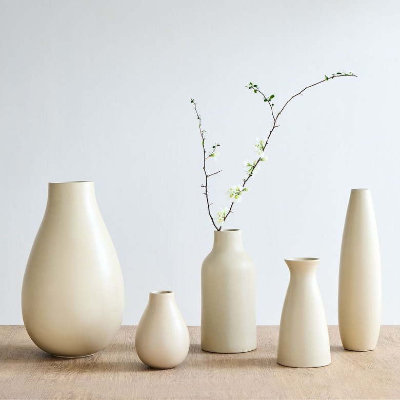 sand colored different sized vases