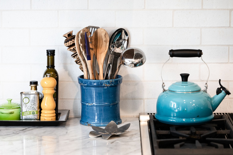 focus on countertop with blue kettle