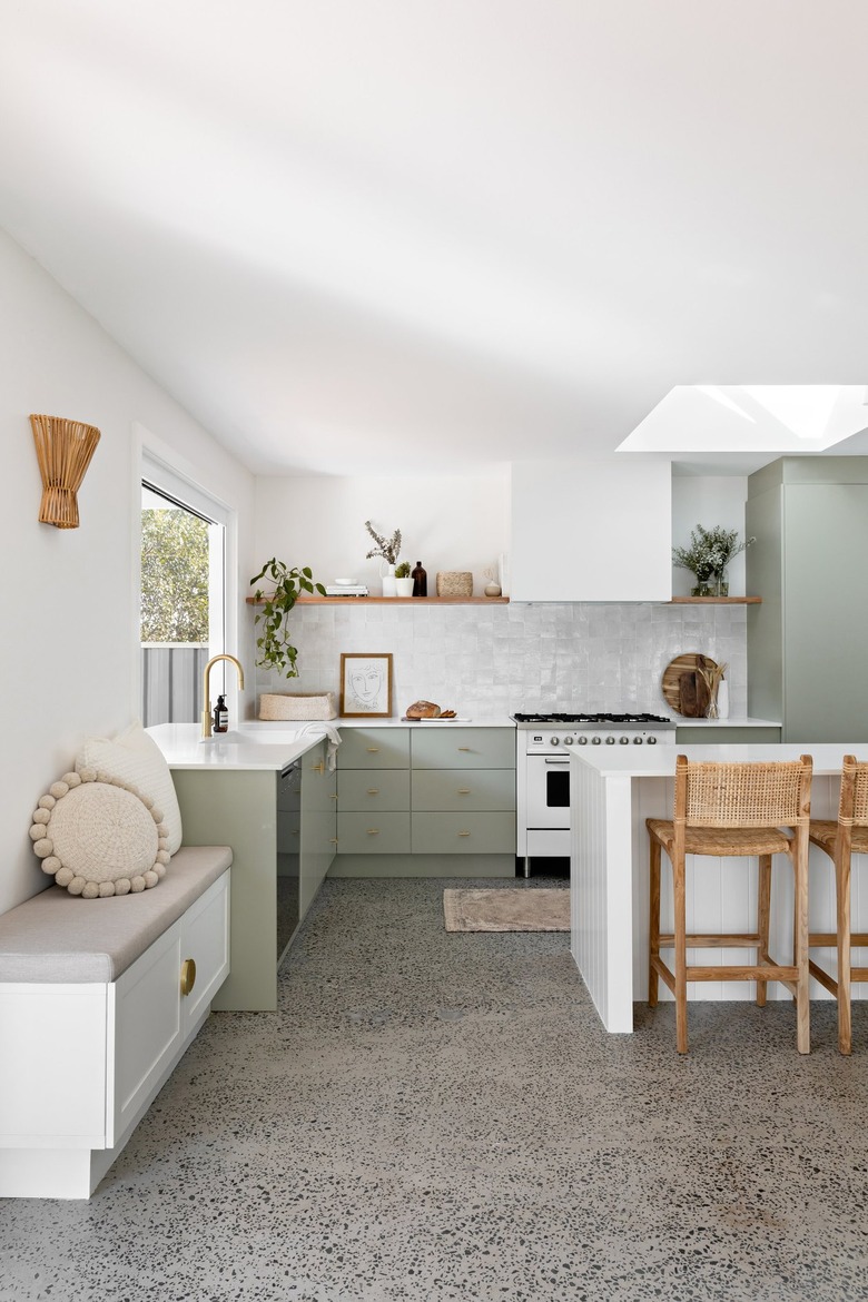 light gray flooring and backsplash color goes with sage green cabinetry